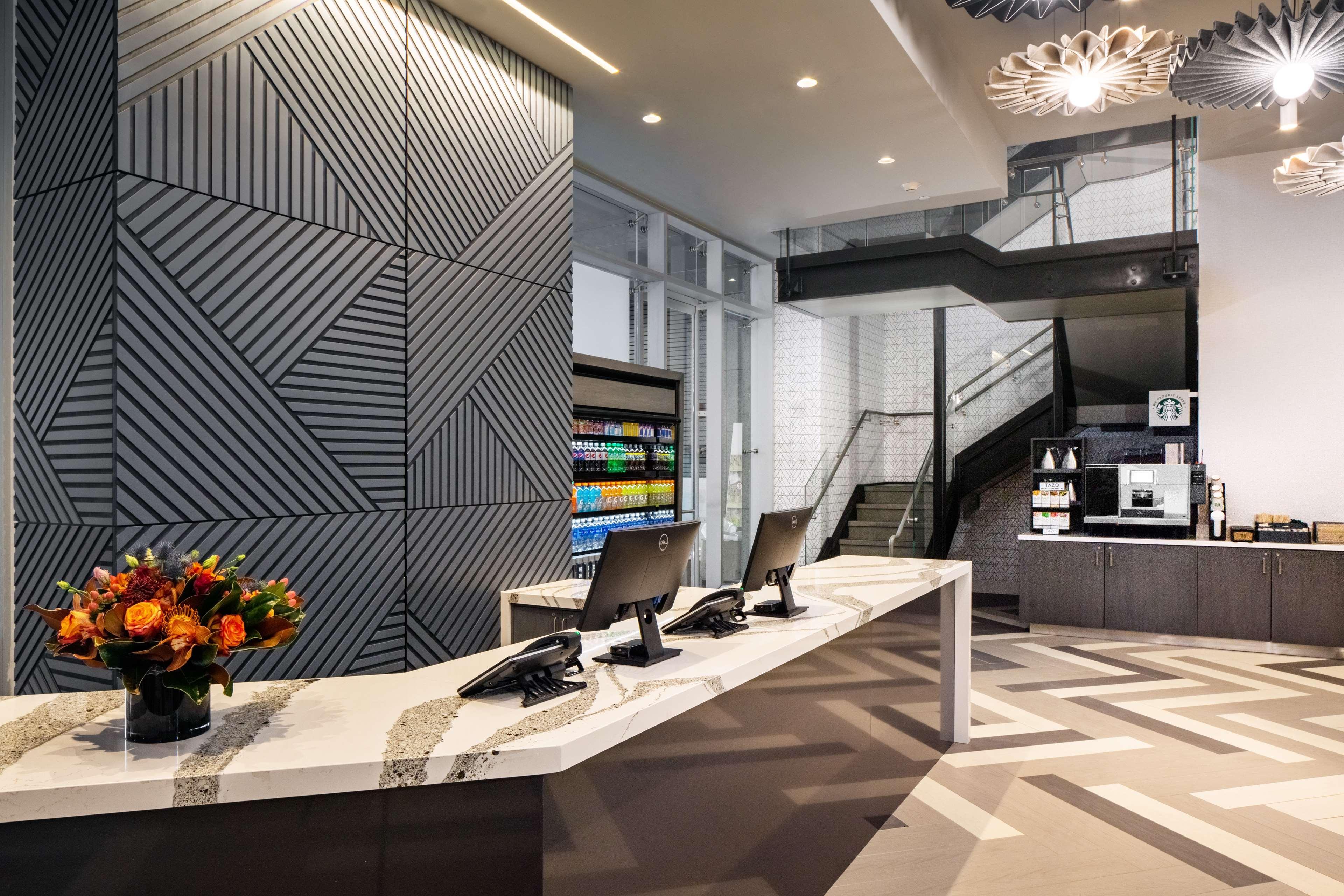 Hyatt Place New York Chelsea Exterior photo Reception desk at a modern hotel